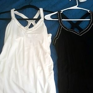 Set of 2 dressy tank tops. One black, one white.